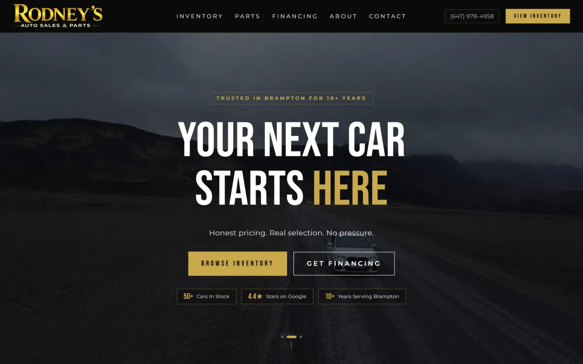 Rodney's Auto Sales homepage with the headline Your next car starts here over a mountain road